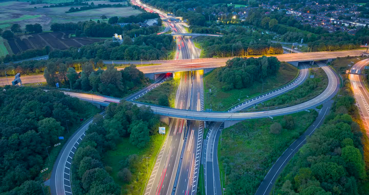 Drone view of UK roads and moving traffic